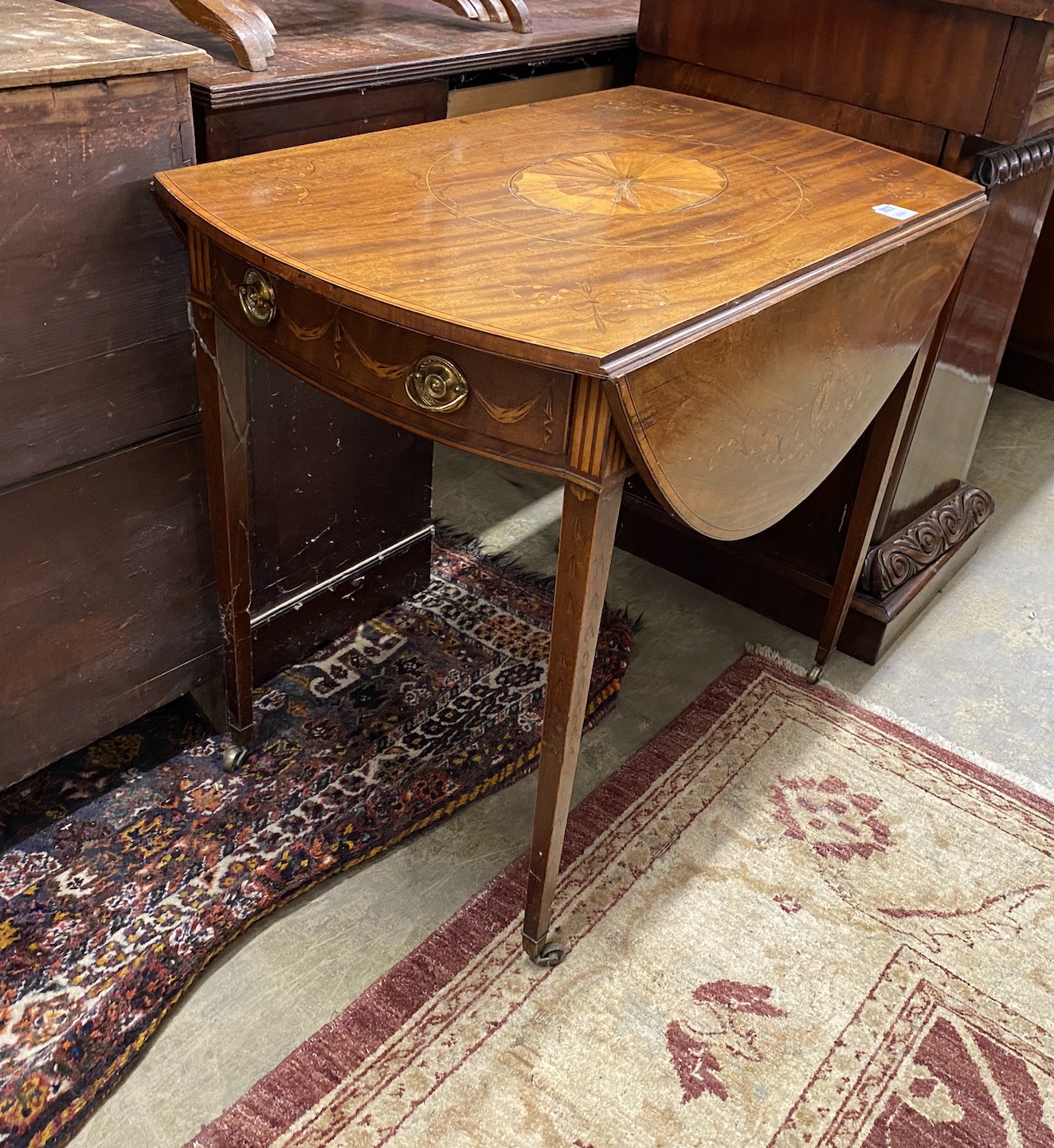 A George III marquetry inlaid oval mahogany Pembroke table, width 85cm, depth 52cm, height 72cm